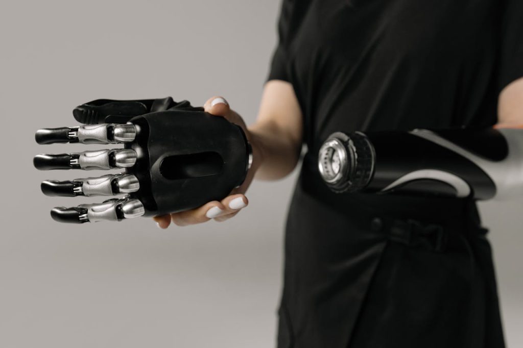 person-with-prosthetic-hand-6153067 A detailed view of a prosthetic arm and hand, showcasing modern assistive technology.